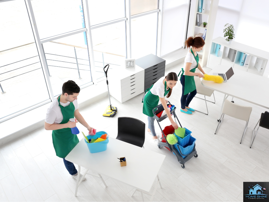 Team cleaning modern office