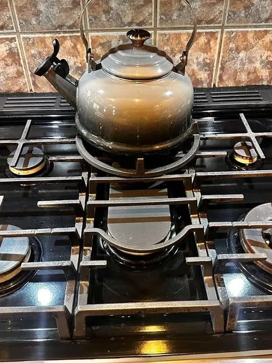 The same gas cooktop after cleaning